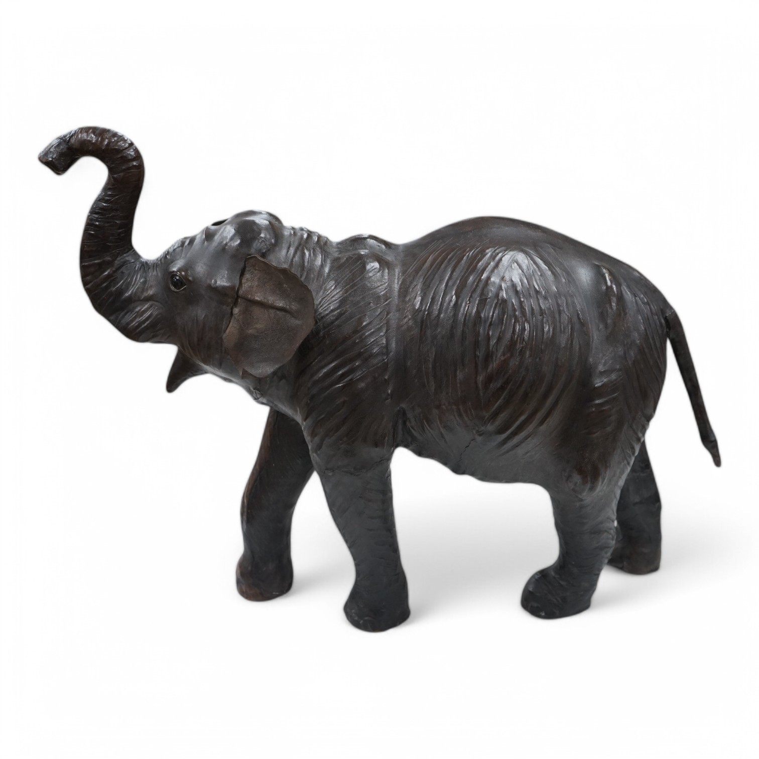 A large Liberty style leather elephant, 64cm wide. Condition - fair, minor repairs